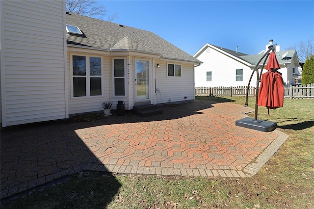 view of patio / terrace featuring entry steps and fence