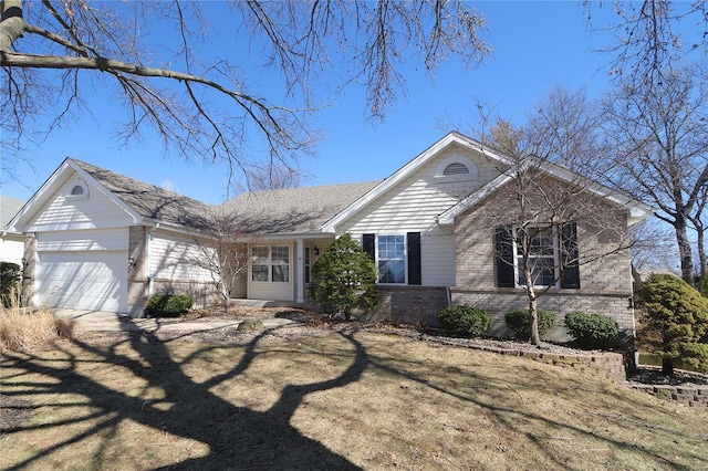 ranch-style home with a garage and brick siding