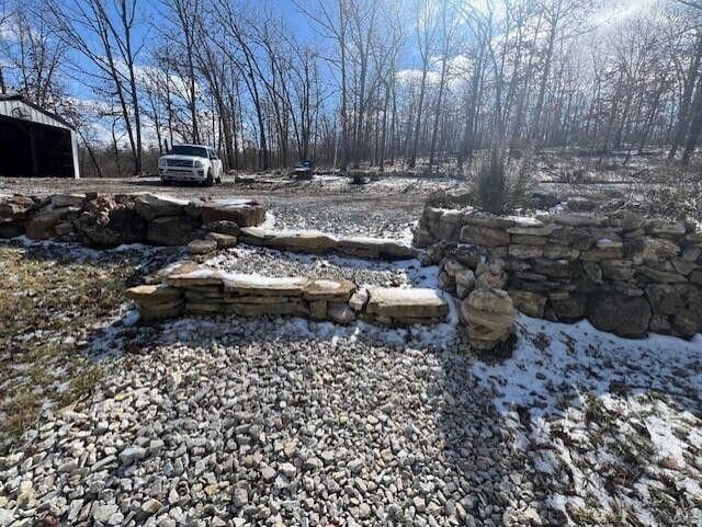 view of yard layered in snow