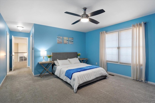 bedroom featuring carpet, visible vents, ceiling fan, and baseboards