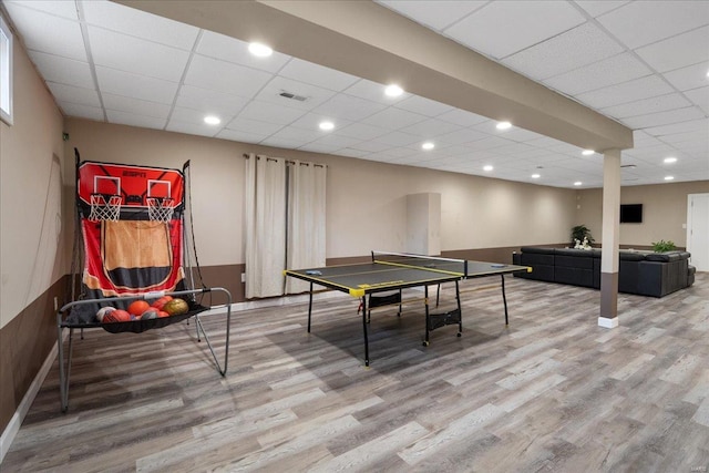 game room with visible vents, a drop ceiling, wood finished floors, and recessed lighting