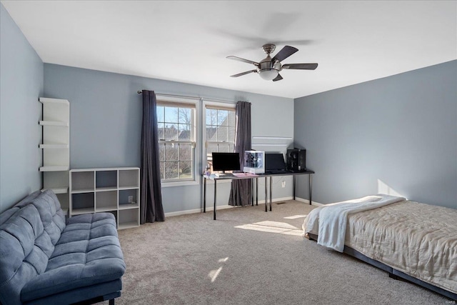 bedroom with carpet, a ceiling fan, and baseboards