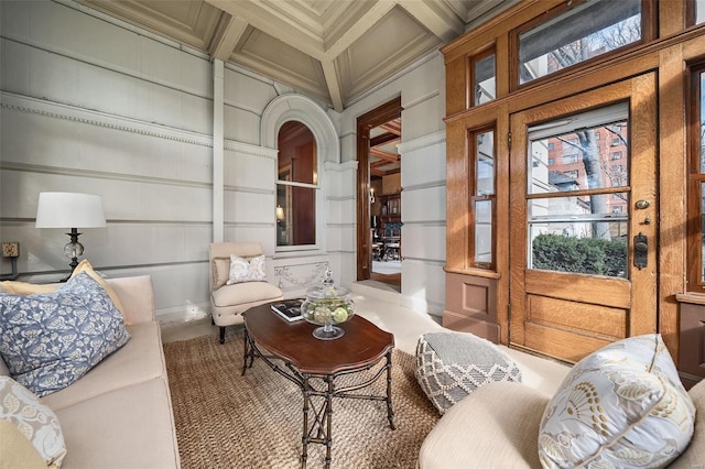 interior space featuring coffered ceiling and beamed ceiling