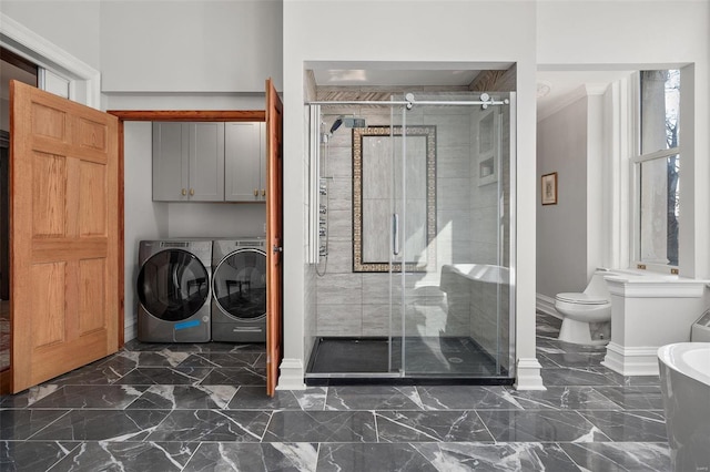 laundry room with baseboards, marble finish floor, cabinet space, and washer and dryer