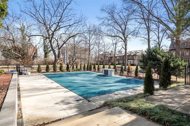 view of pool with fence and a residential view