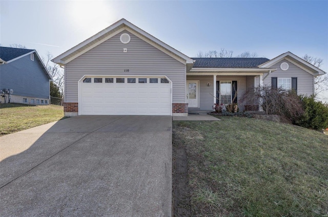 ranch-style home featuring driveway, a porch, a front yard, a garage, and brick siding