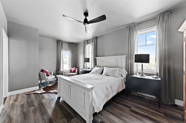 bedroom featuring dark wood finished floors, baseboards, and ceiling fan