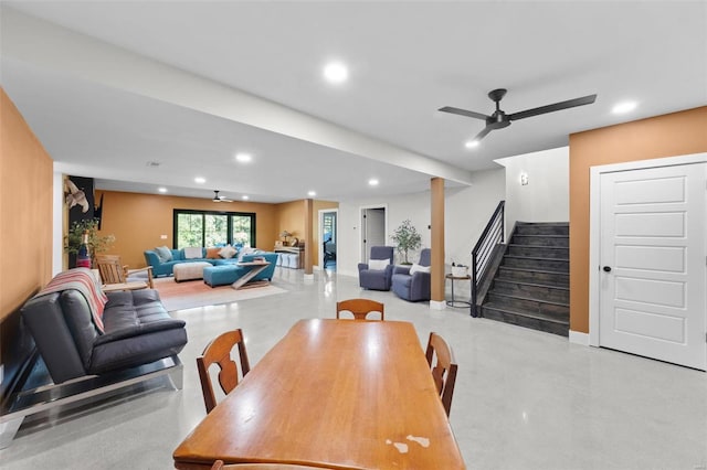 dining room with ceiling fan, concrete flooring, recessed lighting, baseboards, and stairway