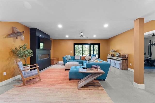 living area featuring a ceiling fan, recessed lighting, and baseboards