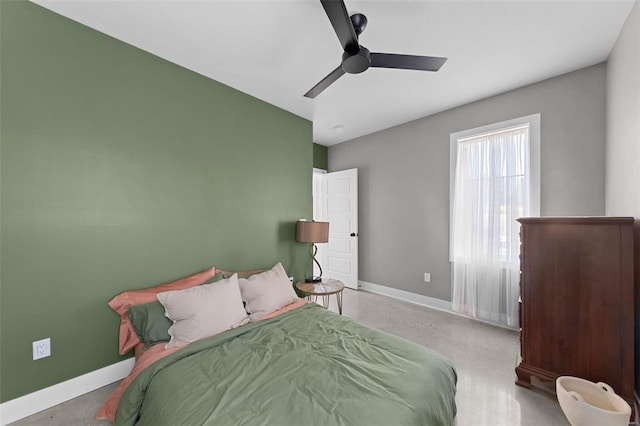 bedroom with ceiling fan and baseboards