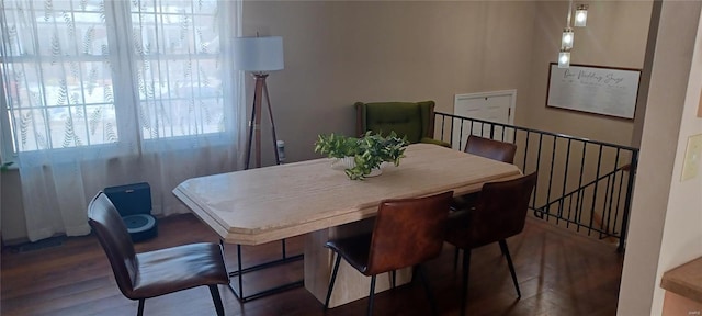 dining space with dark wood-type flooring