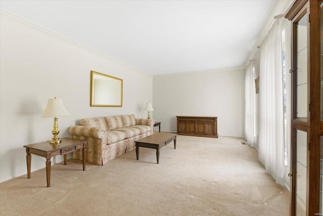 living area featuring crown molding and light colored carpet