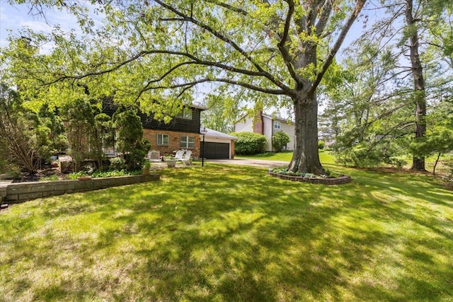 view of yard featuring a garage