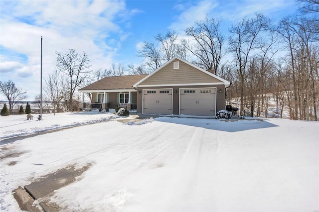 view of front of house with a porch and a garage