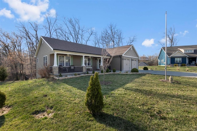 view of front of house featuring a porch, a garage, driveway, and a front lawn