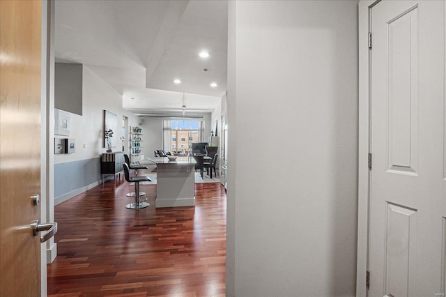 interior space with dark wood-style floors, recessed lighting, and baseboards