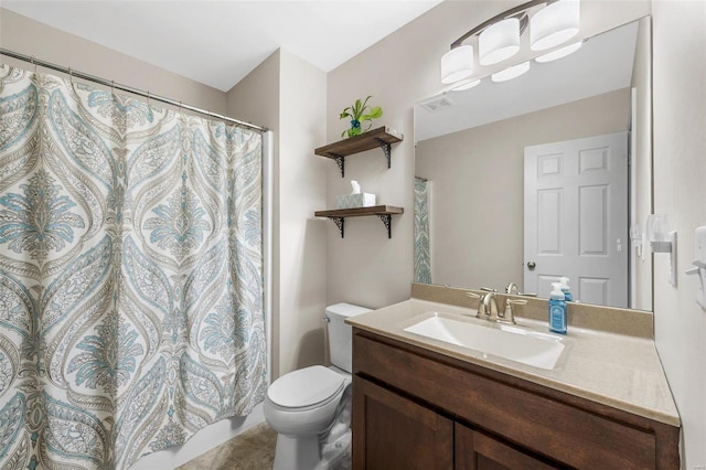 full bathroom with toilet, vanity, and visible vents