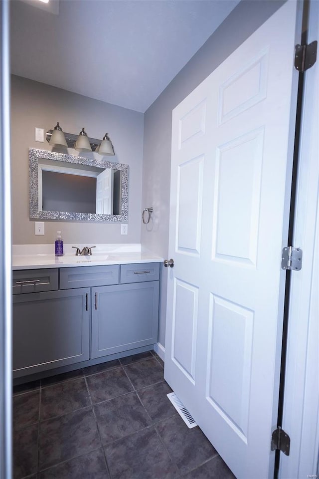 bathroom featuring visible vents and vanity