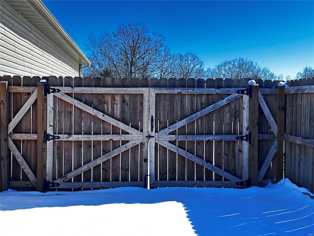 snow covered gate with fence