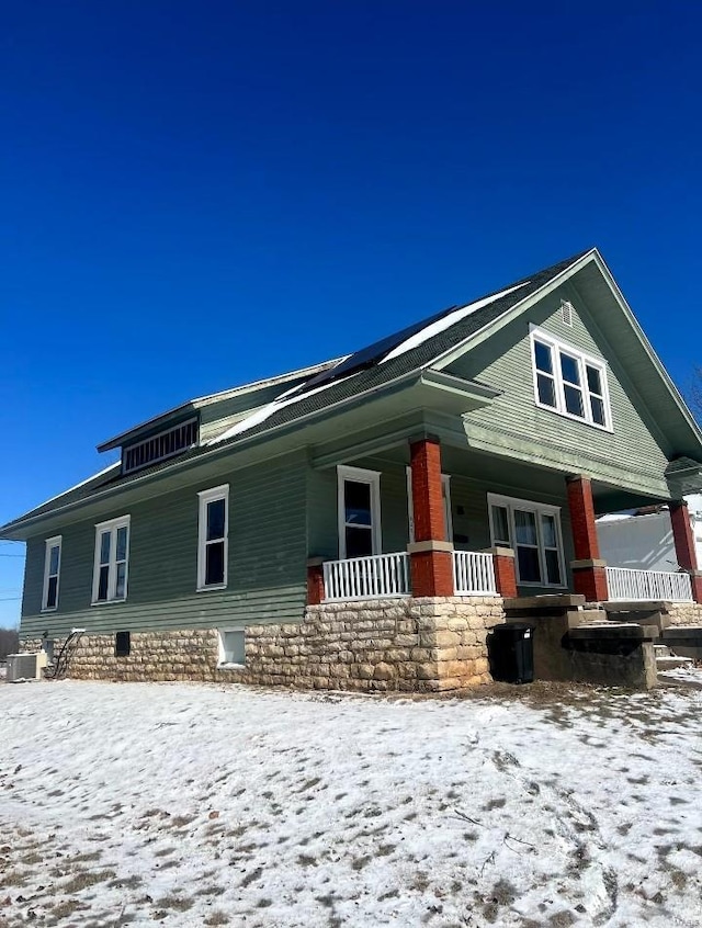 view of front of property featuring crawl space, covered porch, and central air condition unit