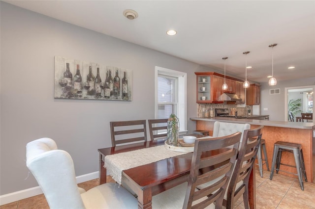 dining space featuring recessed lighting, visible vents, baseboards, and light tile patterned flooring