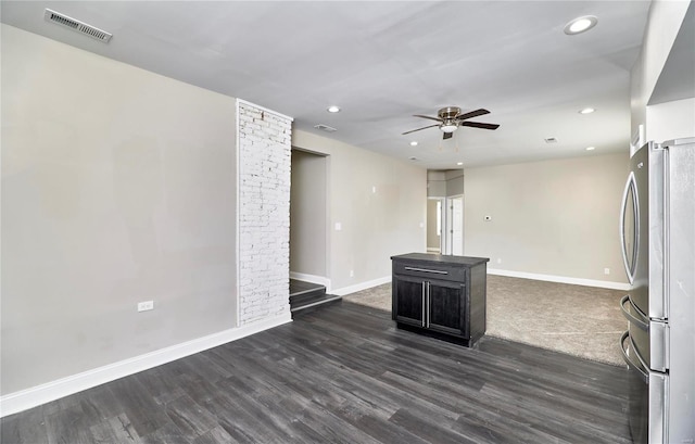 unfurnished living room featuring baseboards, visible vents, recessed lighting, ceiling fan, and dark wood-type flooring