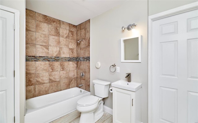 full bathroom with shower / bathing tub combination, baseboards, toilet, and vanity