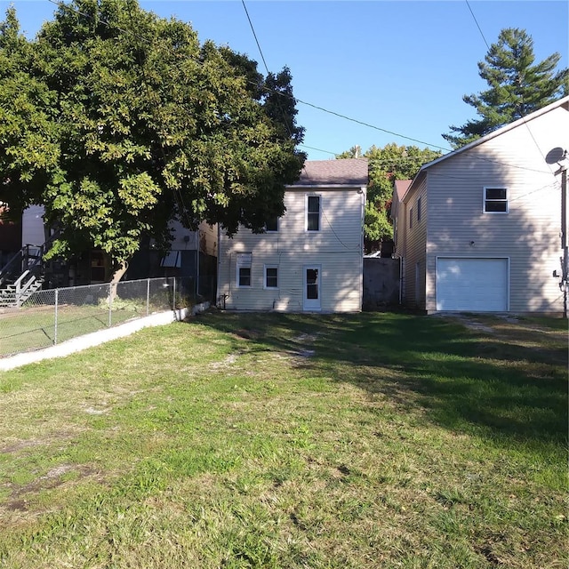 exterior space featuring fence and a garage