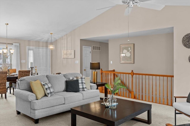 living room featuring visible vents, vaulted ceiling, carpet flooring, and a chandelier