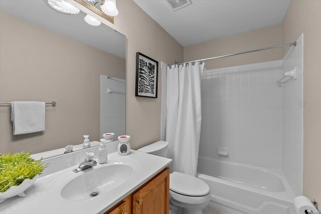 bathroom featuring toilet, visible vents, shower / tub combo with curtain, and vanity