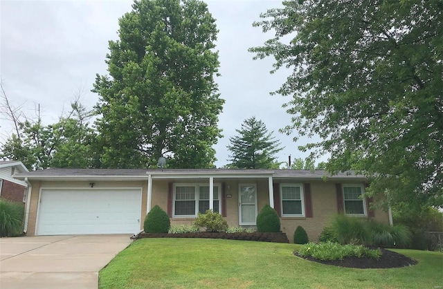 ranch-style home with a garage, concrete driveway, brick siding, and a front yard