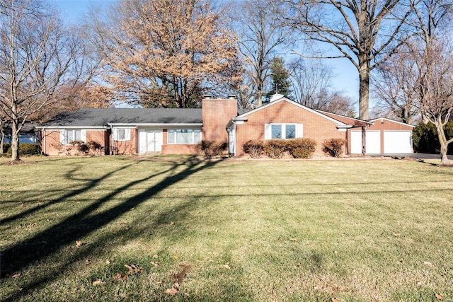 ranch-style home with brick siding, a chimney, and a front lawn