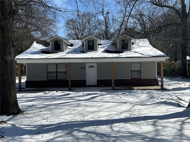 view of front of house with brick siding