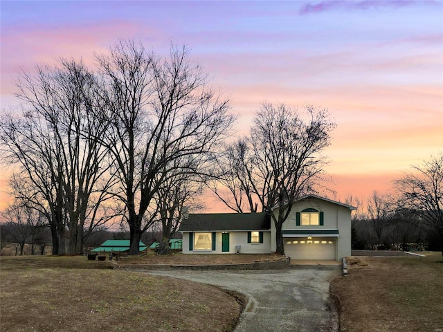 view of front of property featuring a garage and driveway