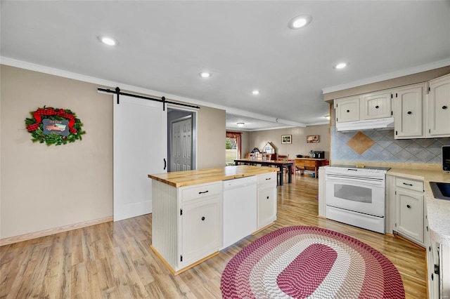 kitchen featuring a barn door, white appliances, light wood-style floors, wooden counters, and crown molding