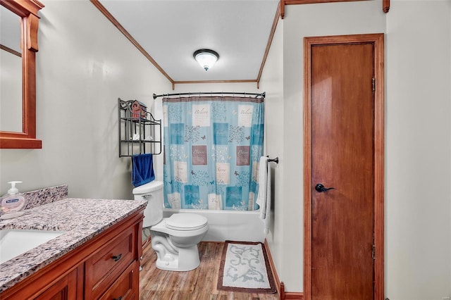 full bathroom featuring toilet, ornamental molding, shower / tub combo, vanity, and wood finished floors