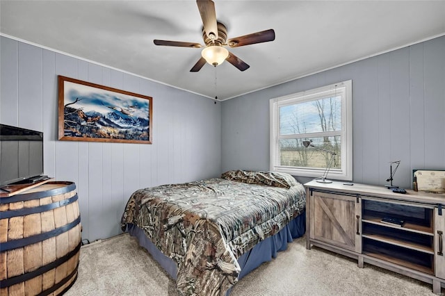 bedroom with a ceiling fan and light colored carpet