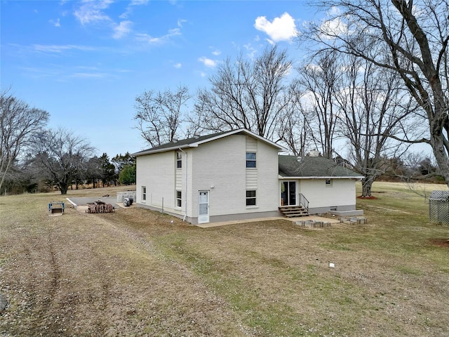 rear view of property with entry steps