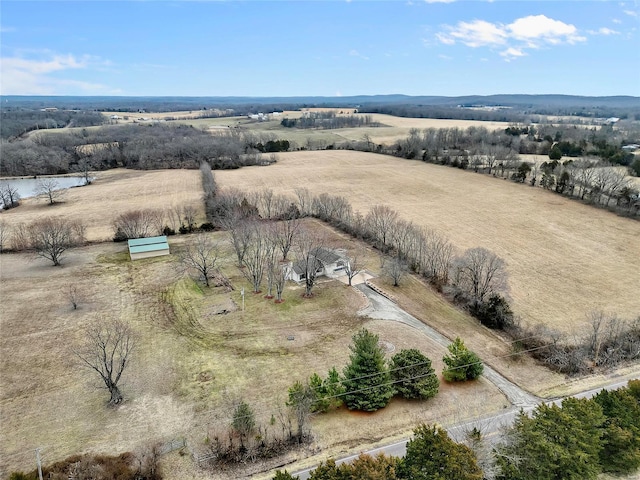 birds eye view of property with a rural view