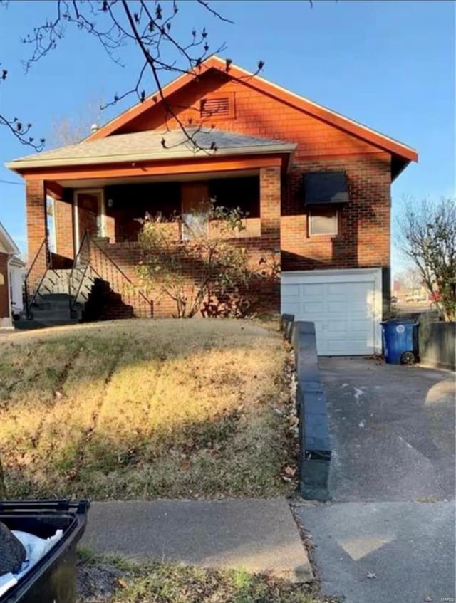 view of front of house with a garage and brick siding