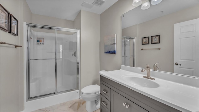 bathroom featuring toilet, a shower stall, visible vents, and vanity