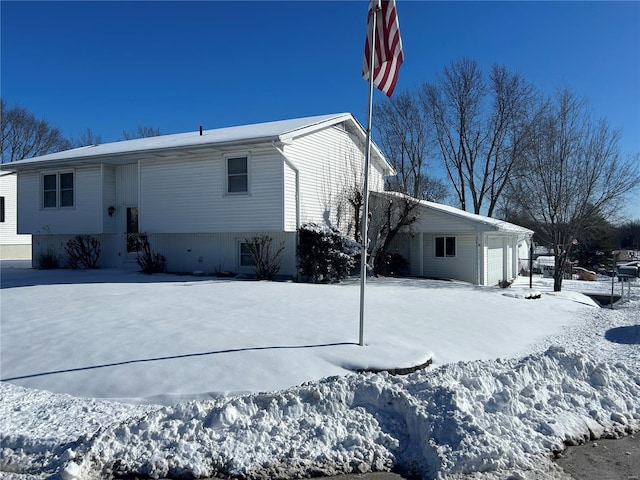 view of snow covered house