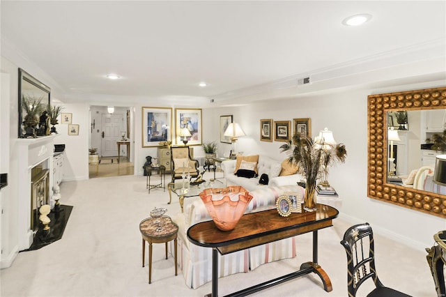 dining space with light carpet, a fireplace with flush hearth, visible vents, and recessed lighting