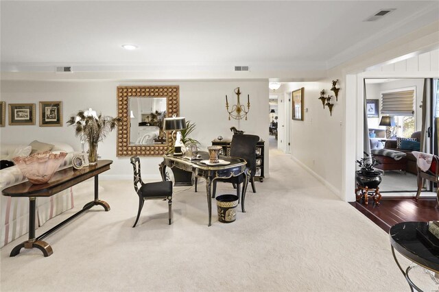 dining room featuring ornamental molding, visible vents, and baseboards