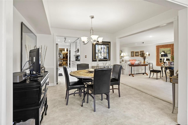 dining space featuring light carpet, an inviting chandelier, and recessed lighting