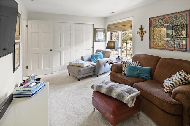 living area featuring light colored carpet