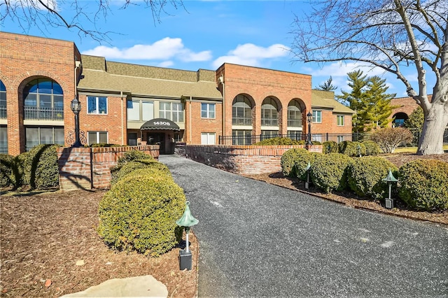 view of building exterior featuring fence