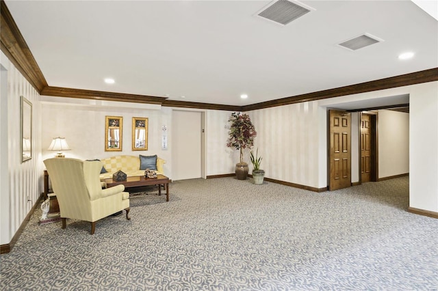 living area featuring baseboards, visible vents, and ornamental molding