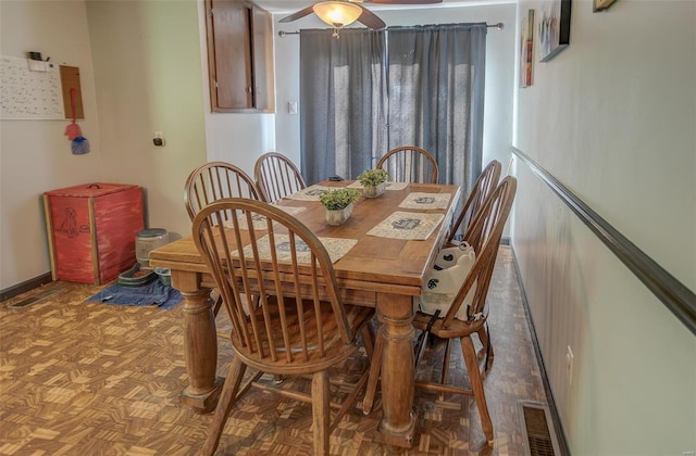 dining space featuring visible vents and a ceiling fan