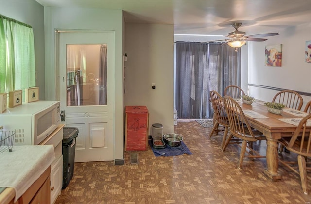 dining area featuring a ceiling fan